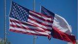US and Texas flags at half mast